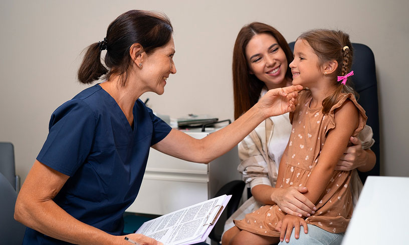 Primary Health Partners provider building a personal relationship with a young patient and her mother