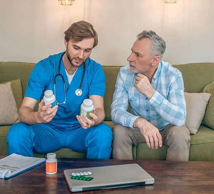 Direct Primary Care physician reviewing wholesale prescription medications one-on-one with a patient at Primary Health Partners